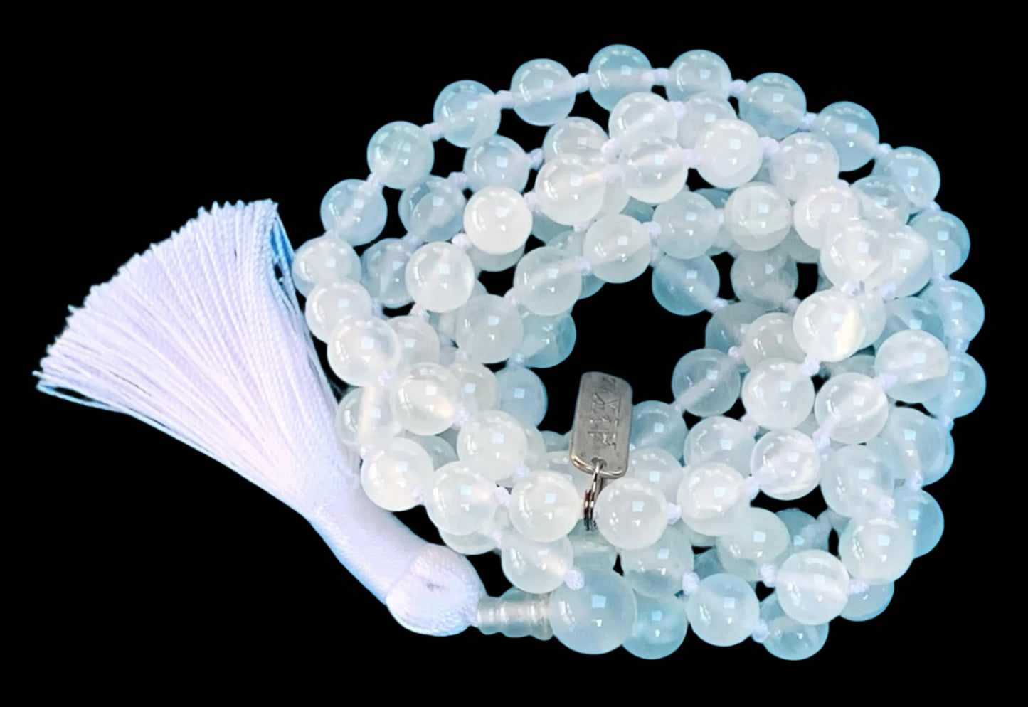 Hand knotted selentte mala necklace with 8mm bead size and 108 beads strung in white nylon thread and white tassel
