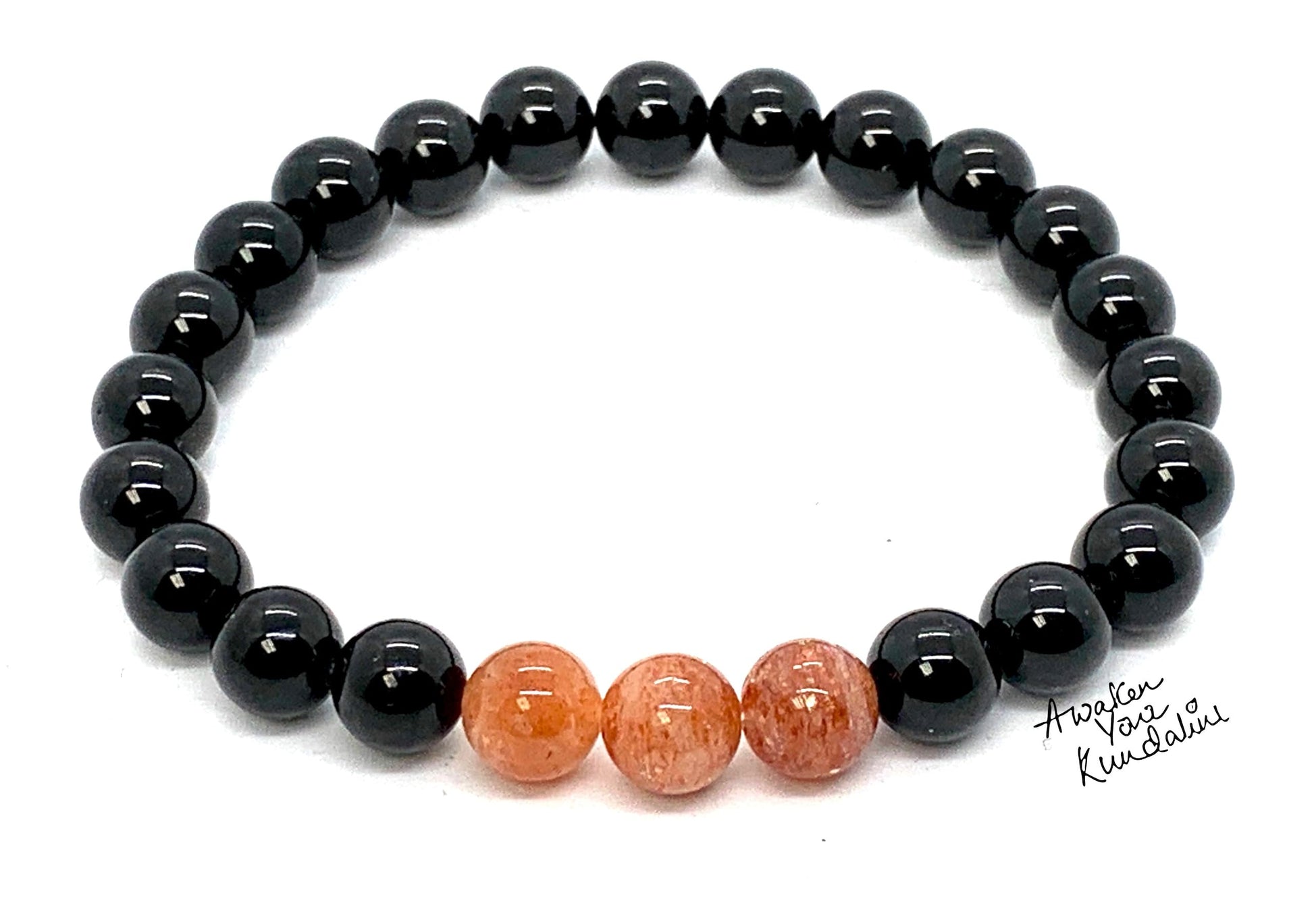 Black Tourmaline AAAAA Grade Sunstone Stretch Bracelet 8mm beads arranged in circular pattern, Root Chakra Solar Plexus Chakra healing jewelry, VESTA Collection handmade USA, energy protection confidence bracelet, premium gemstones spiritual jewelry, AYK quality