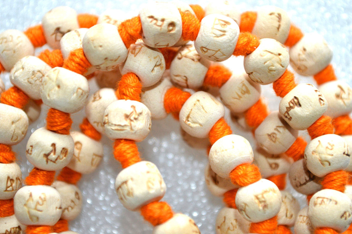 AWAKEN YOUR KUNDALINI Hand Knotted 8mm Tulsi Mala Necklace - Gemini Birthstone, Heart Chakra Alignment, Ram Engraving, Orange String & Tassel