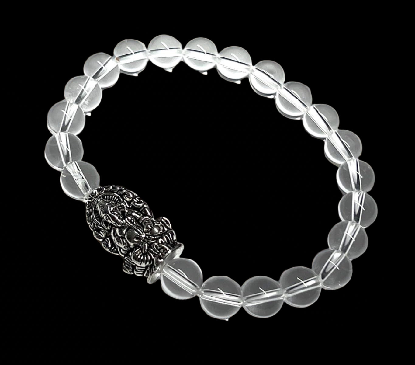 8mm Clear Crystal Quartz beaded stretch bracelet with a silver intricate Ganesha charm