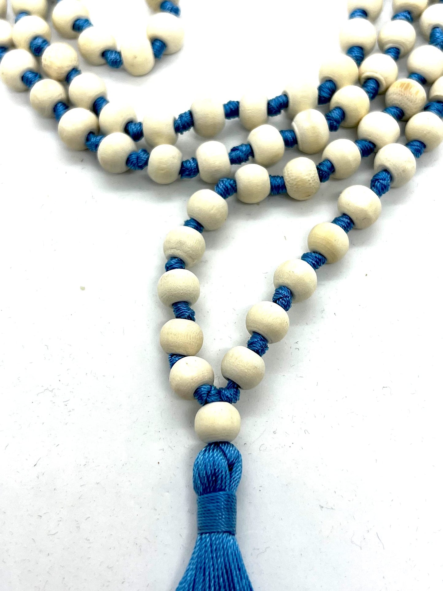 AWAKEN YOUR KUNDALINI Hand Knotted 8mm Tulsi Mala Beads Necklace with Sky Blue String and Tassel - Gemini Sun Sign, Heart Chakra Alignment
