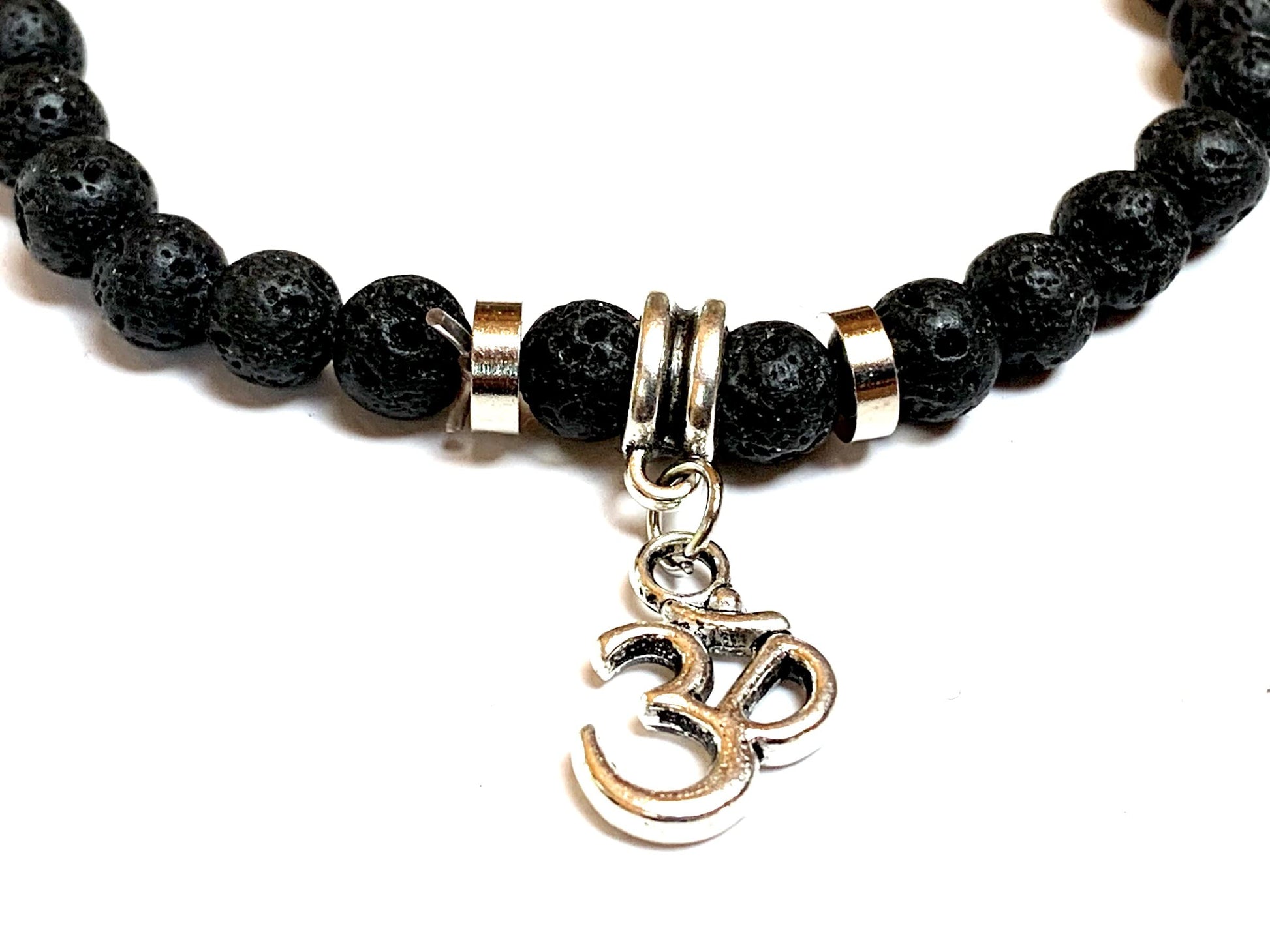 VULCAN AKSHA Lava Om Charm Bracelet Close-up 8mm Natural Stone Sacred Om Symbol Root Chakra Grounding Aromatherapy Volcanic Energy Spiritual Protection Handmade USA AYK Collection