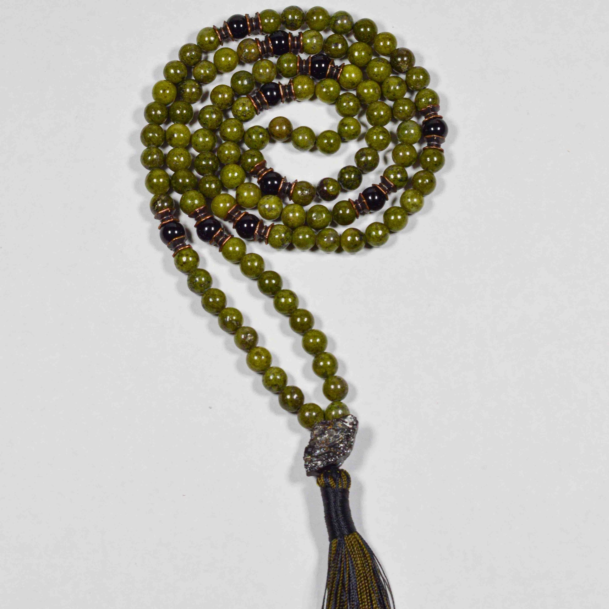 Detailed view of hand-knotted Green African Jade and Black Tourmaline beads for protection, growth and balance