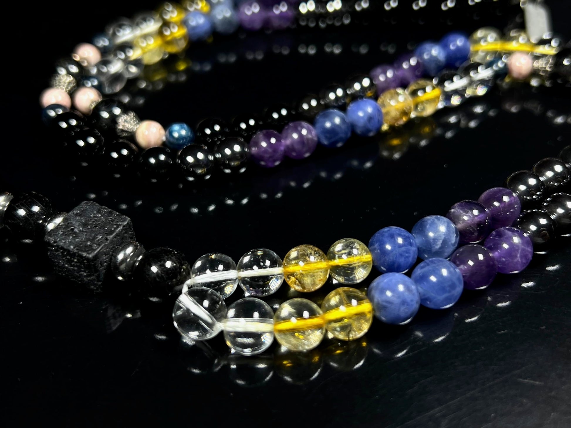 Saturn Retrograde Mala Necklace Lifestyle Shot - 108 Bead Spiritual Transformation Jewelry - Karmic Clearing Protection Stones - Quartz Lava Citrine Lapis Amethyst Hematite Tourmaline Rhodochrosite Kyanite Astrophyllite - VESTA Collection - Cosmic Timing Divine Wisdom - AYK Awaken Your Kundalini