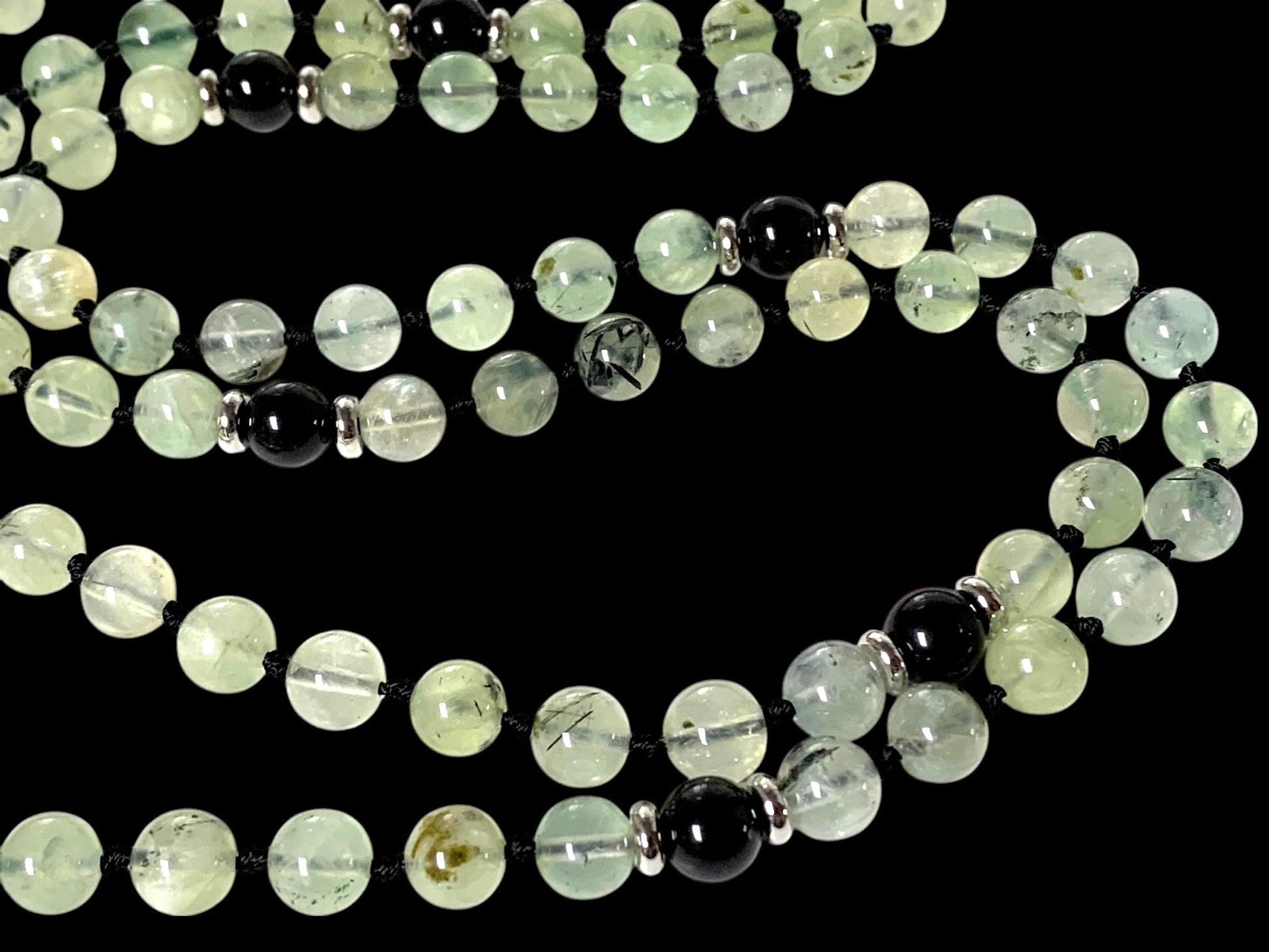 Person wearing Prehnite Mala Necklace during meditation, 108 beads Heart Chakra Solar Plexus Chakra activation, ORACLE Collection spiritual jewelry, handmade USA quality, prehnite healing energy, chakra balancing meditation practice