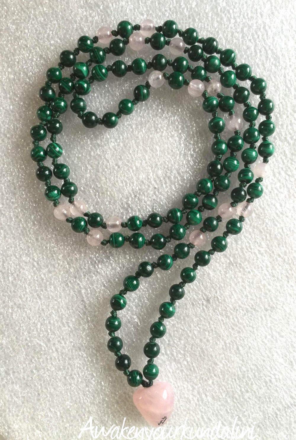 Detailed view of hand-knotted Malachite and Rose Quartz beads for transformation, love and communication