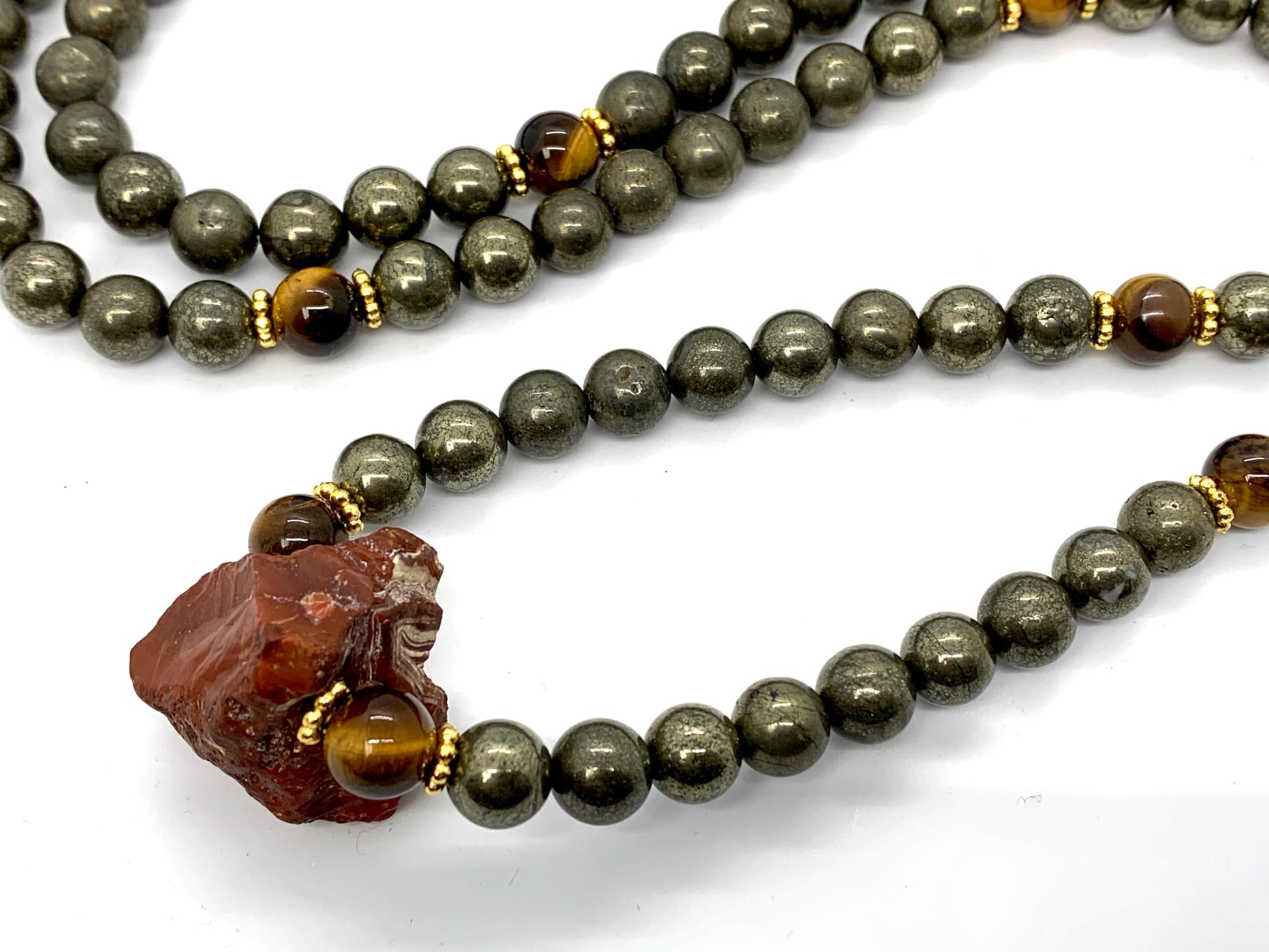 Carnelian Tiger's Eye Pyrite Mala Necklace Lifestyle View 108 Beads Hand-Knotted HIRANYA Collection Solar Plexus Sacral Chakra Protection Abundance Healing Meditation Natural Stone Handmade USA AYK