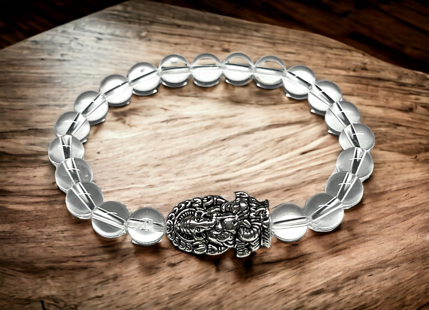 8mm Clear Crystal Quartz beaded stretch bracelet with a silver intricate Ganesha charm