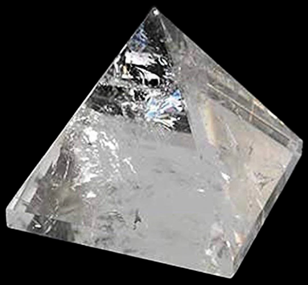 Crystal quartz pyramid on a black background