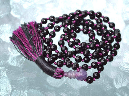 Detail shot of Black Tourmaline beads with different colored thread options for personalization