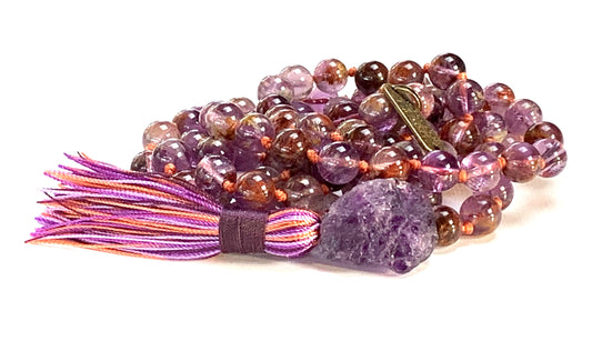 Close-up view of Cacoxenite Auralite 23 and Amethyst beads showing natural stone patterns by AYK