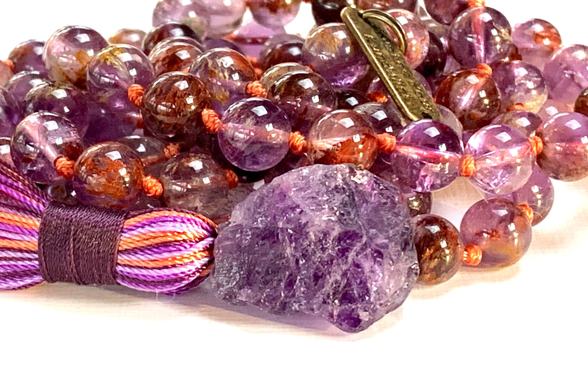 Hand-knotted 108 bead mala necklace with Cacoxenite and Amethyst gemstones by AYK