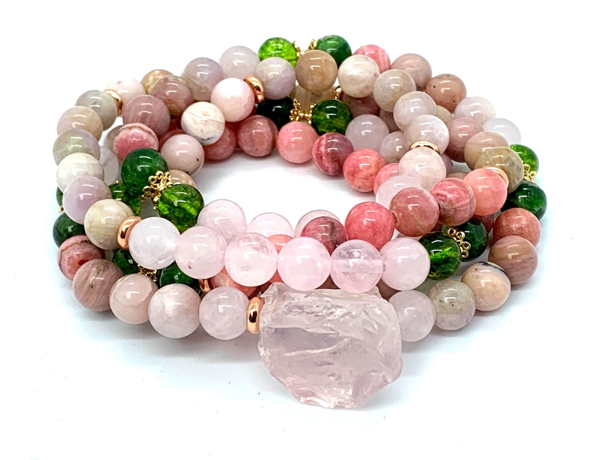 Close-up view of Self Love Mala beads showing rose quartz, rhodonite, kunzite and pink opal gemstones