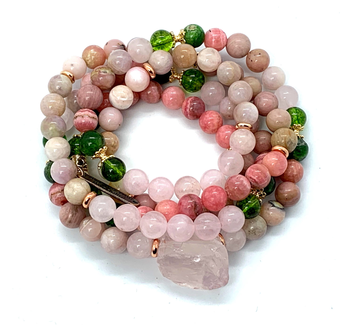 Detail shot of rose quartz, peridot, rhodonite and moonstone beads in Self Love Mala