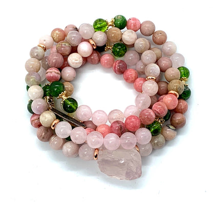 Detail shot of rose quartz, peridot, rhodonite and moonstone beads in Self Love Mala