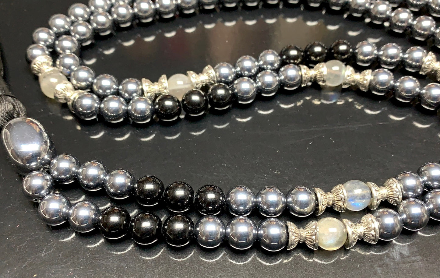Close-up view of Tourmaline Terahertz Labradorite beads showing natural stone patterns and colors