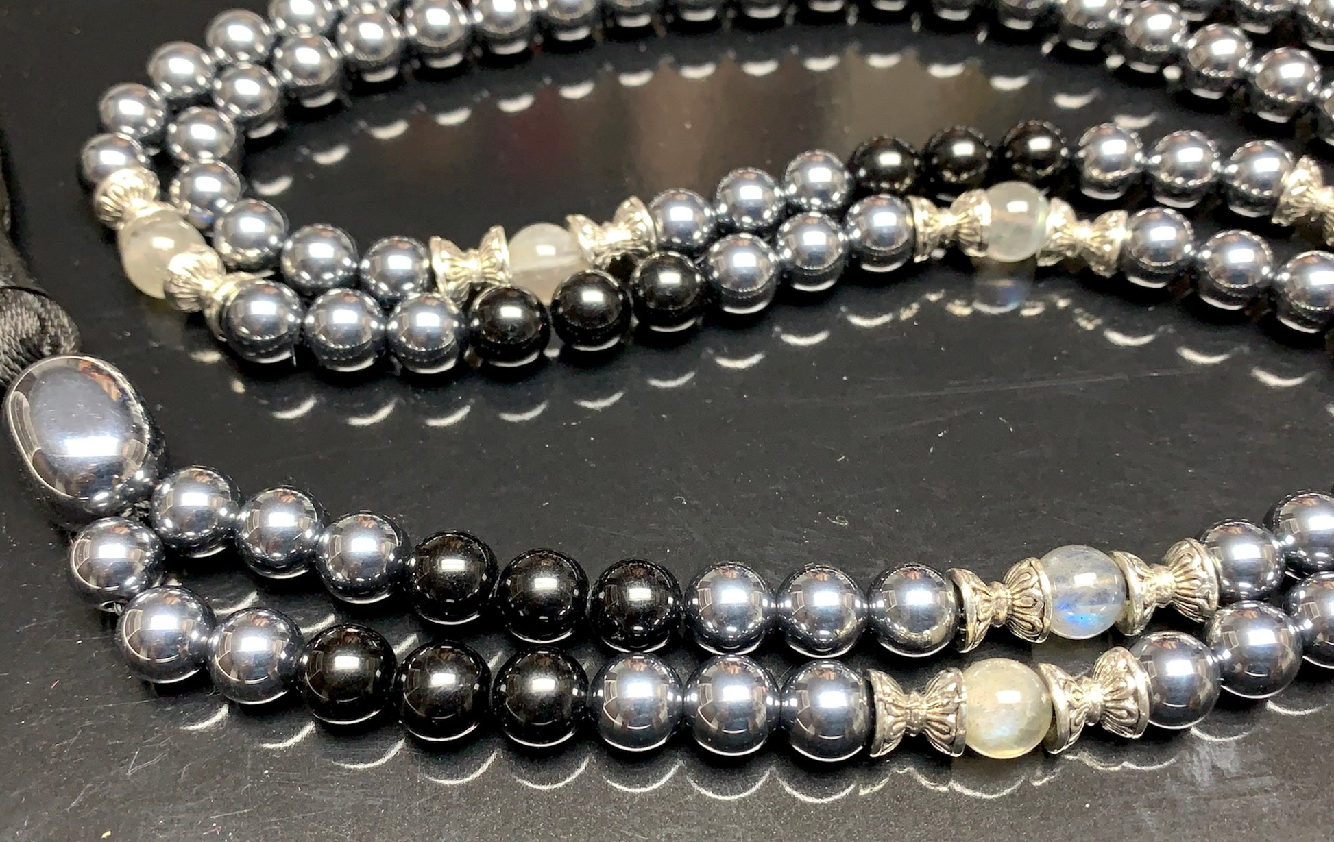 Close-up view of Tourmaline Terahertz Labradorite beads showing natural stone patterns and colors