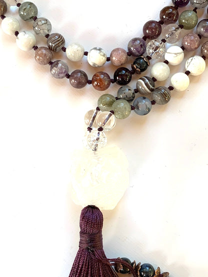 Close-up view of Sacred Crown Chakra Mala beads showing quartz, amethyst, sugilite and crown chakra stones
