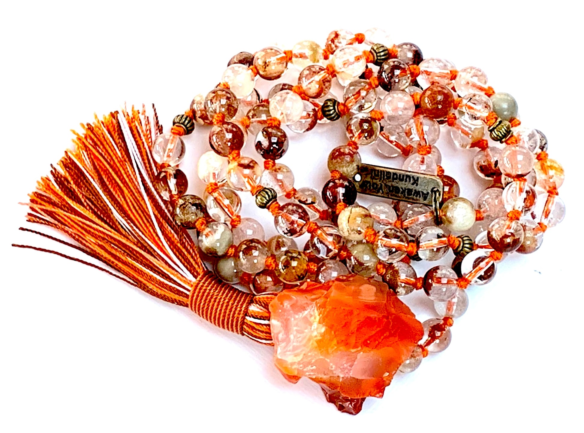 Detail shot of lodolite garden quartz and carnelian beads for vision clarity and vitality
