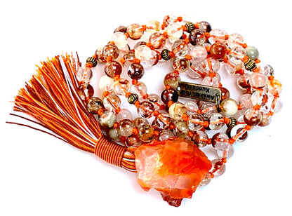 Detail shot of lodolite garden quartz and carnelian beads for vision clarity and vitality
