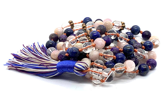 Close-up view of Celestial Vision Mala beads showing charoite, lapis lazuli, peach moonstone and crystal quartz