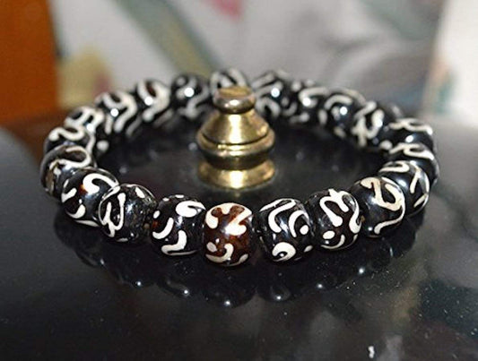 AWAKEN YOUR KUNDALINI Yak Bone Stretch Bracelet, 10mm Beads w/Om, Sagittarius Sun Sign, Crown Chakra