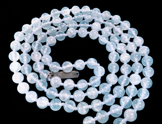 Hand knotted selentte mala necklace with 8mm bead size and 108 beads strung in white nylon thread and white tassel