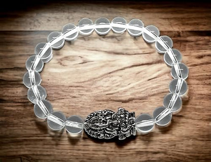 8mm Clear Crystal Quartz beaded stretch bracelet with a silver intricate Ganesha  charm