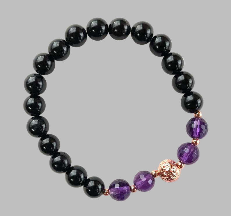 Black and purple beaded bracelet on a white background by AYK