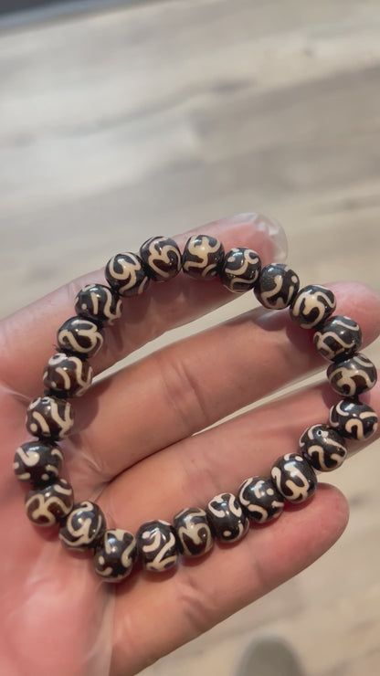 AWAKEN YOUR KUNDALINI Yak Bone Stretch Bracelet, 10mm Beads w/Om, Sagittarius Sun Sign, Crown Chakra